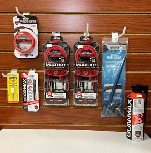 lot 1366 image: (7) Firearm Tools (2) Real Avid Multi-Kit Cleaning Kits, Bore Boss, Speed Brush, Hoppes Brush, Gun Oil, Gunslick Bore Guide