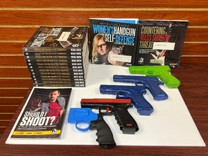 lot 1427 image: Training tools (5) Firearm Simulators (15) Training books