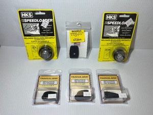 lot 1459 image: Firearm Accessories (2) HKS Speedloader (3) Pearce Grip S&ampW M&ampP grip extension (1) Brownells Mag Pad for M&ampP .45