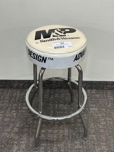 lot 1513 image: Chrome Stool with M&P by Smith & Wesson on seat
