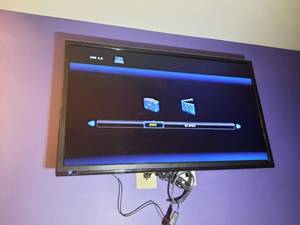 lot 821 image: Westinghouse Flat Screen TV with wall mount.