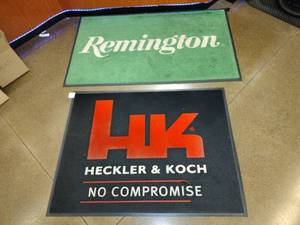 lot 1615 image: (2) Advertising Floor Mats,  Hecker & Koch, 36 x 48 and Remington, 35 x 58