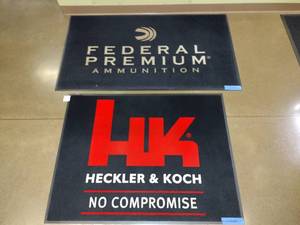 lot 1616 image: (2) Advertising Floor Mats,  Hecker & Koch, 48 x 36 and Federal Premium Ammunition, 59 x 34
