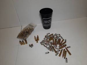 lot 1651 image: Glock Cup with bullets marked 44 REM among others