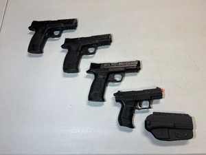 lot 1665 image: (4) Black Pistol Simulatorrs and (1) Holster