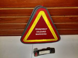 lot 1712 image: Roadway Hazard Markers North American Rescue Combat Application Tourniquet