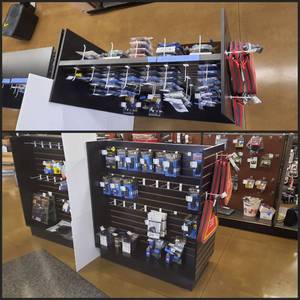 lot 1717 image: Black Wood Double-Sided Slatwall Merchandiser on solid base