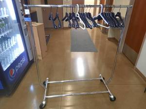 lot 1733 image: Hanging Clothes Rack with hangers, on wheels