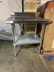 lot 1886 image: Regency 24 x 30 18-gauge 304 stainless steel commercial work table with a 4 backsplash