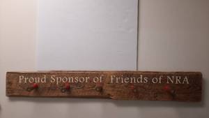 lot 1884 image: Wood Hat Rack NRA Proud