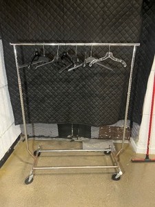 lot 1938 image: Hanging Clothes Rack with hangers, on wheels