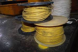 lot 29 image: Spools of Yellow 14 Gauge Stranded Copper Wire