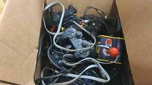 lot 33 image: Box of misc X-Box and Playstation controllers and wires