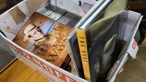 lot 84 image: Box of John Wayne shows, music, books and decor