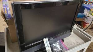 lot 117 image: Insignia LCD Color TV with DVD Player built in.