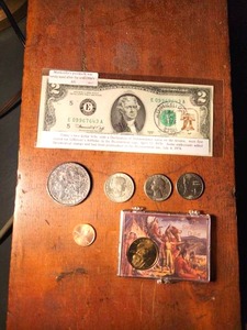 lot 140 image: Uncirculated Sacagawea Dollar & Monticello Postmarked U.S. $ 2 U.S. Currency and more.