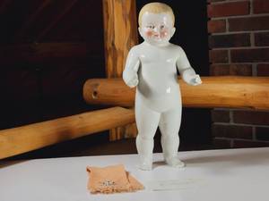 lot 408 image: Antique Frozen Charlie Boy China Doll