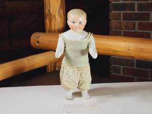 lot 410 image: Antique Frozen Charlie Boy China Doll