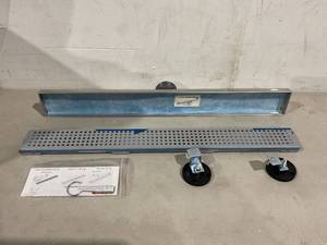 lot 168 image: Neodrain 24-Inch Linear Shower Drain with Quadrato Pattern Grate - Brushed Stainless