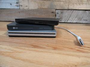 lot 74 image: Lot of THREE Portable DVD Writers - Unchecked (AppleLGDell)