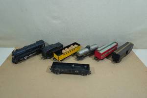 lot 61 image: Assorted Vintage Marx Model Train Cars - 999 Locomotive