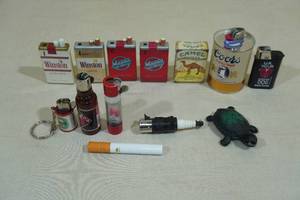 lot 149 image: 13 Vintage Advertisement Lighters - Winston, Red Dog, Camel