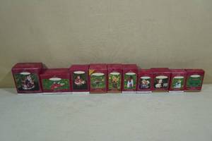lot 223 image: 10 Vintage Hallmark Keepsake Christmas Ornaments -Santas Bumper Car, Feliz Navidad, Safe and Snug