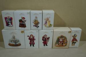 lot 227 image: 9 Vintage Hallmark Keepsake Christmas Ornaments -Father Christmas Rock Candy Railroad, Toymaker Santa