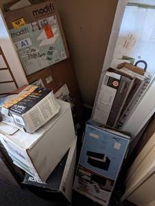 Closet filled with slat wall, medicine cabinets, flooring and more