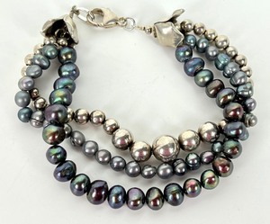 lot 137 image: Triple Strand Pearl and Sterling Bracelet