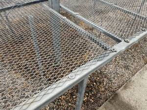 lot 4 image: Five Tables - Fixed. Expanded metal 3 ft. high greenhouse growing tables.