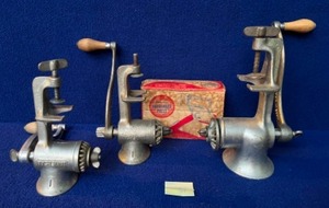 lot 13 image: Vintage Universal Table Clamp Hand Crank Meat Grinders (2) No.1 and (1) No. 2 , FoodCo Hamburger Press with Original Box.