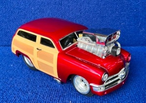 lot 53 image: Vintage Collectible 2001 Funline 1950 Red Ford Woody Muscle Machine 118 Die-Cast Car
