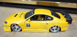 lot 23 image: Hard to FindYellow #22 Jada 2002 Nissan Silvia S15 Import Racer Die-Cast Collectible 124 Scale