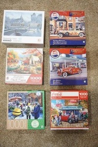 lot 64 image: Hobbies Puzzles Six Boxed 1000 Piece One-Setting Jigsaw Puzzles...