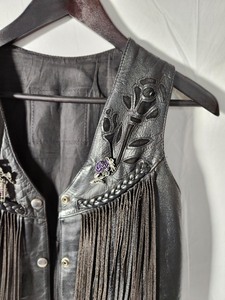 lot 32 image: Vintage Womens Black Leather Vest with Fringe and Rose Cut Out No Size Listed - Looks to be a S