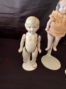 lot 126 image: Three Antique German All Bisque Miniature Dolls with Stands