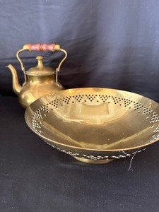 lot 128 image: Vintage Brass Bowl with Intricate Engraved Design Cutouts and Vintage Brass Teapot with Wood Handle