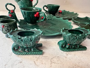 lot 308 image: Vintage Green Lefton Holly and Berry Dishes - Two Snack Plates, 5 Cups, Bell, 2 Egg Cups, 2 Sleigh Candle Holders, 2 Holly Plates