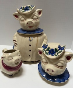lot 13 image: Vintage Sweet Winnie Pig Cookie Jar in blue w Smiley Creamer