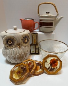 lot 44 image: Lot of MCM Kitchen Serving Pieces, Teapots, Cookie Jar, Acrylic Coasters, Spoon Rest