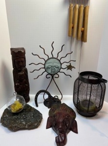 lot 57 image: Sun Face Collectibles, Wind Chimes, Elephant Mask, Marble Trivet & Lantern