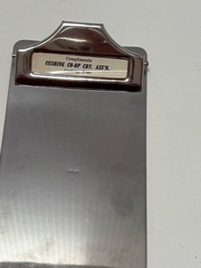 lot 237 image: Vintage Metal Clipboard Advertising Cushing, Wisconsin