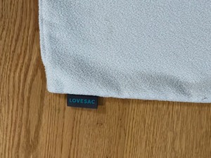 lot 368 image: NEW Lovesac 24 x 24 Decorative Ivory Pillow Cover