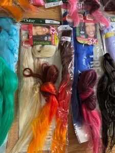 lot 260 image: Huge lot of New Colored Stretched Hair Extensions - Weave in Colors - Over 30 Pieces