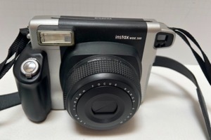 lot 218 image: FUJI Instax Wide 300 Camera, Headphones and earbuds