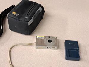 lot 333 image: Canon Power Shot SD100 Digital Elph Digital Point-N-Shoot Camera with Bag and Charger