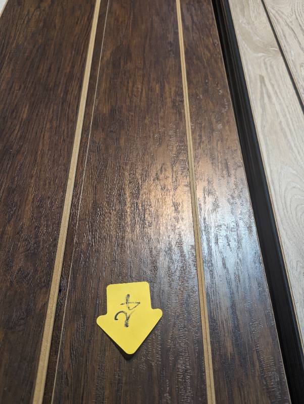 lot 28 image: Dark wood Laminate Flooring - 5.5 in x 48 in -  (76 Sq Ft)