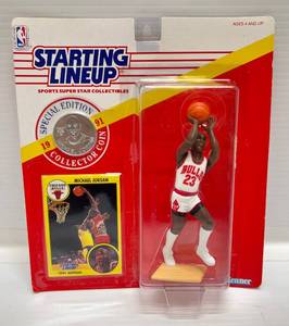 lot 103 image: 1991 Starting Lineup Michael Jordan Figure Shooting  With Card Collectors Coin Sealed