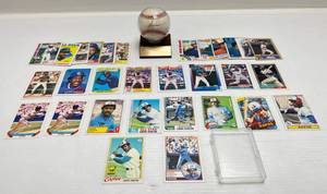 lot 111 image: Signed Andre Dawson Baseball In Holder & Misc. 1977-90s Andre Dawson Cards